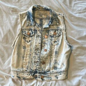 Distressed denim vest